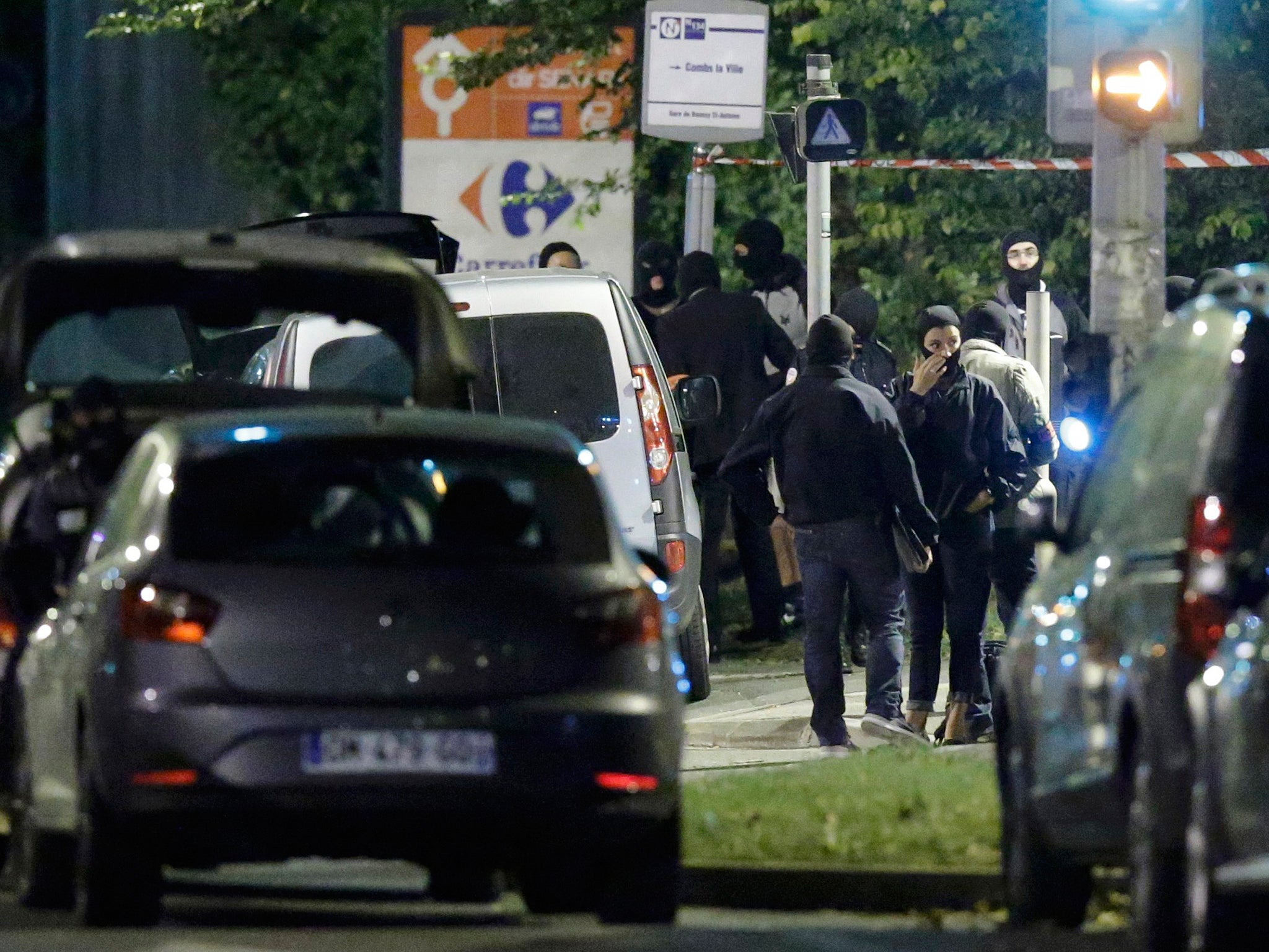 French policemen take part in a police raid in Boussy-Saint-Antoine