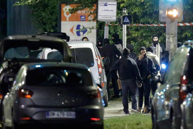 French policemen take part in a police raid in Boussy-Saint-Antoine