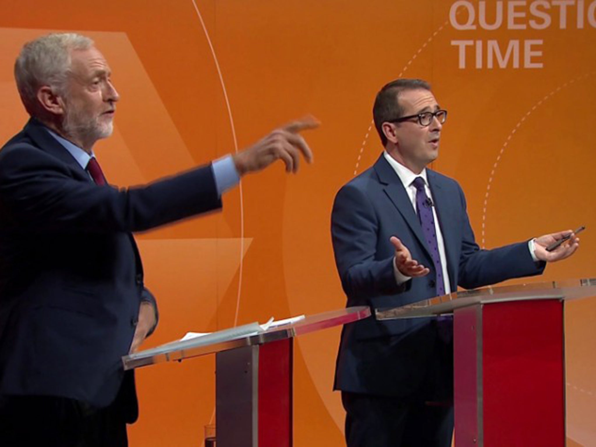 Corbyn (left) and Smith debating in Oldham last night