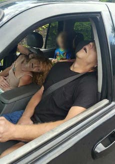 Police share picture of heroin addicts in car with their child