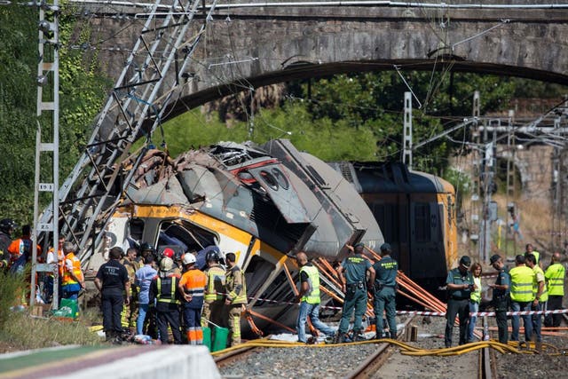 Emergency services at the scene after the train derailed and crashed into a tower