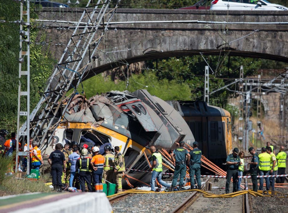 Emergency services at the scene after the train derailed and crashed into a tower