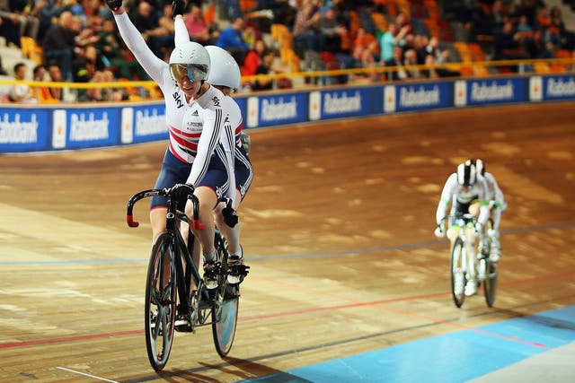 Sophie Thornhill and her tandem pilot Helen Scott celebrate their gold victory