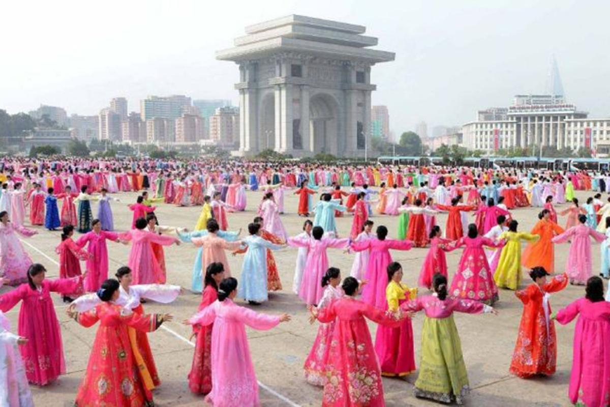 North Korean women dance to celebrate the 68th founding anniversary of the Democratic People's Republic of Korea in Pyongyang