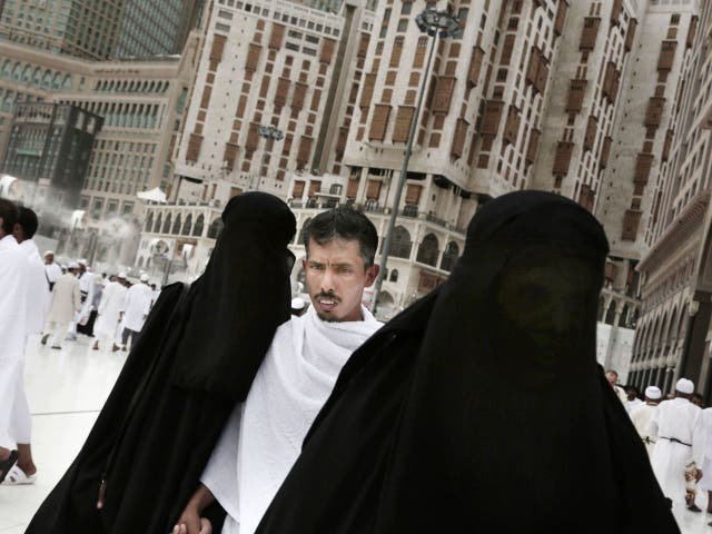 Muslim pilgrims make their way at the Grand Mosque in the Muslim holy city of Mecca, Saudi Arabia