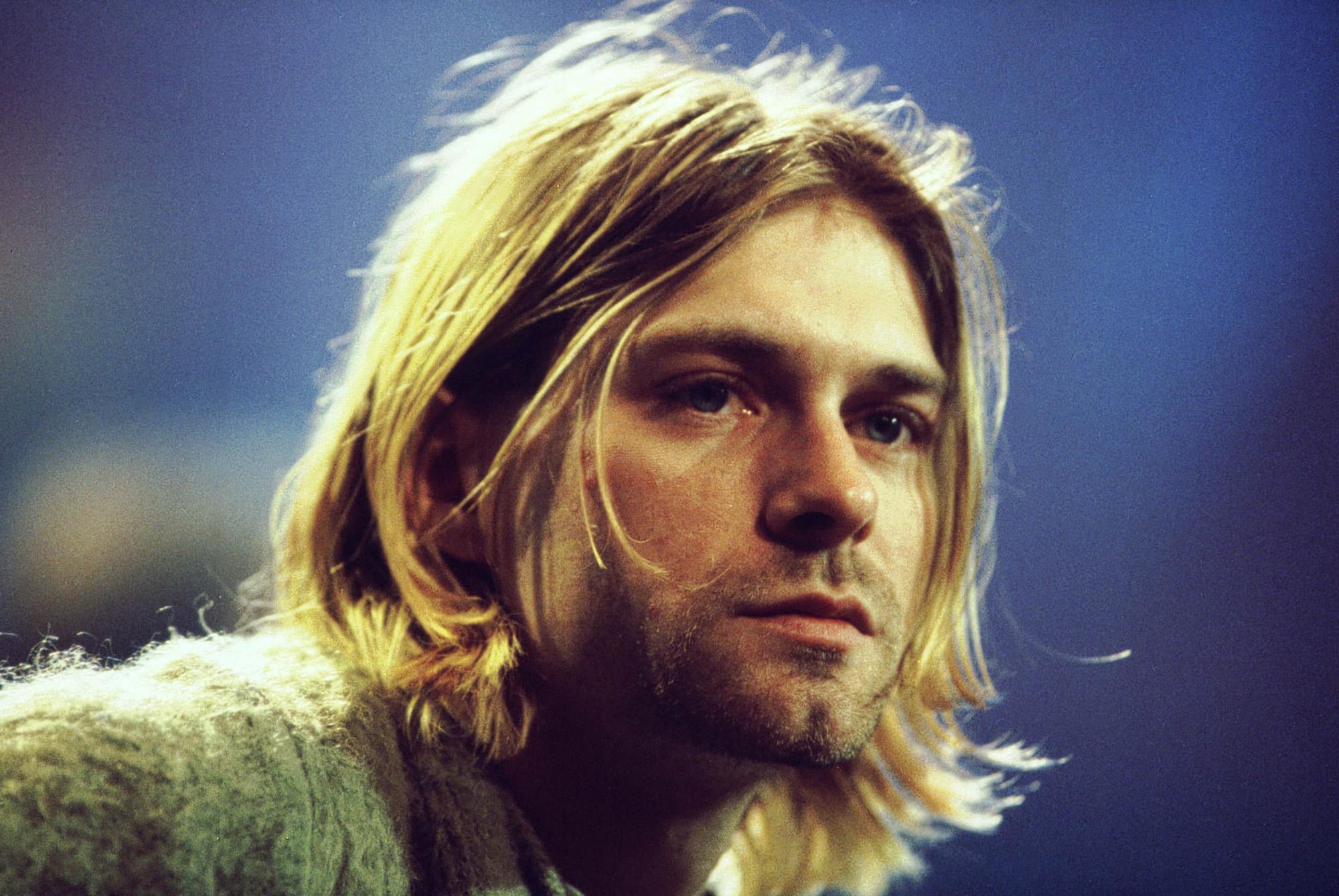 Reluctant voice of a generation: Cobain and Nirvana re-energised rock in the early Nineties, before the singer took his own life, aged 27