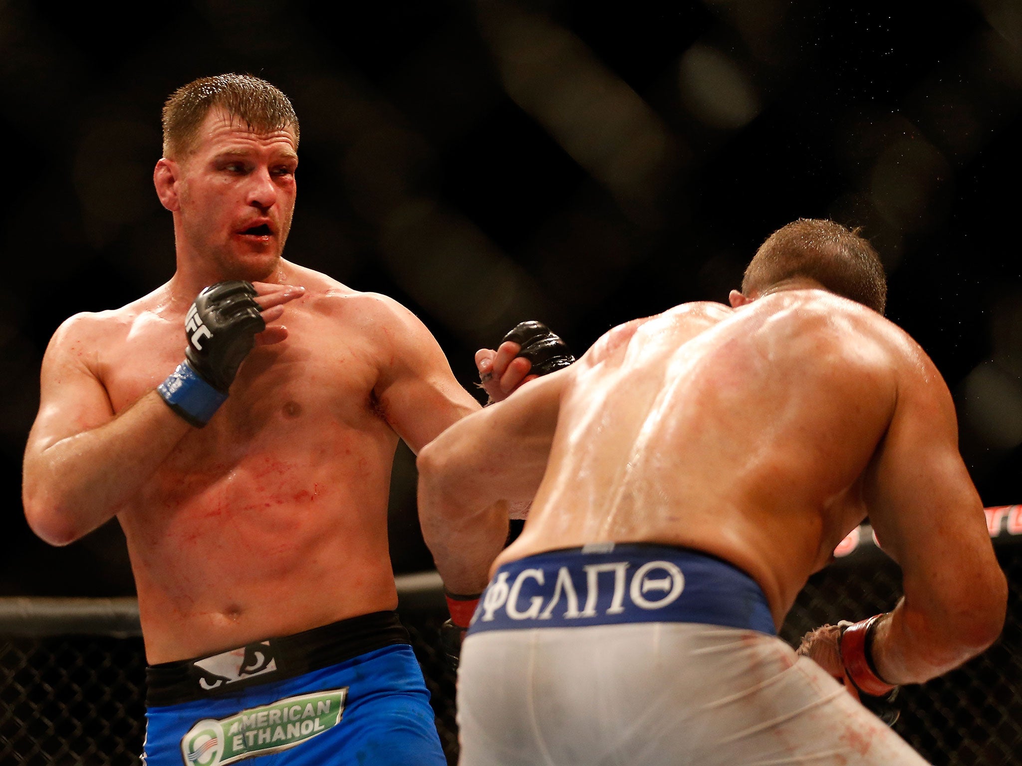 &#13;
Stipe Miocic in action against Junior dos Santos &#13;