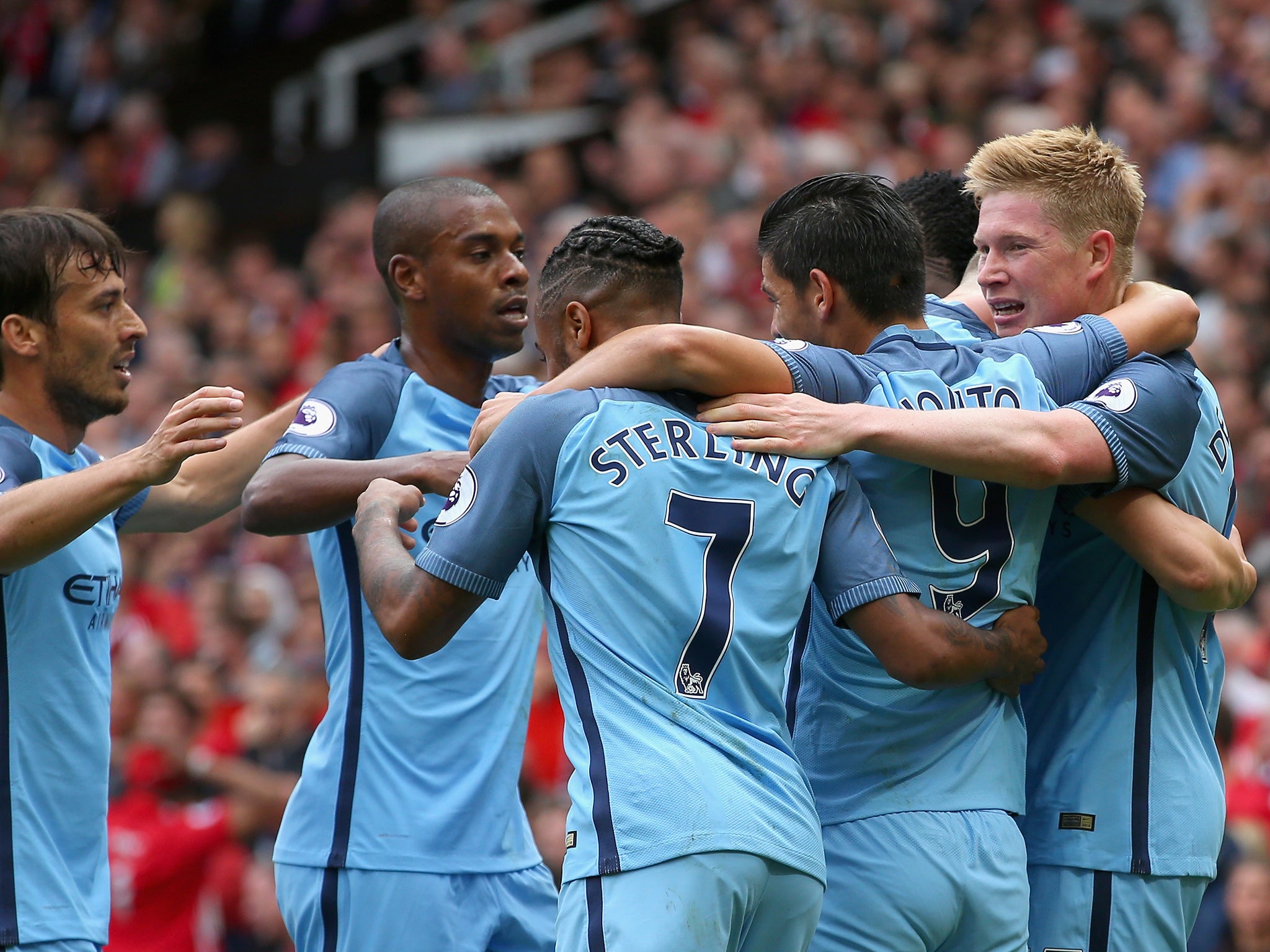 City's players celebrate taking the lead at Old Trafford