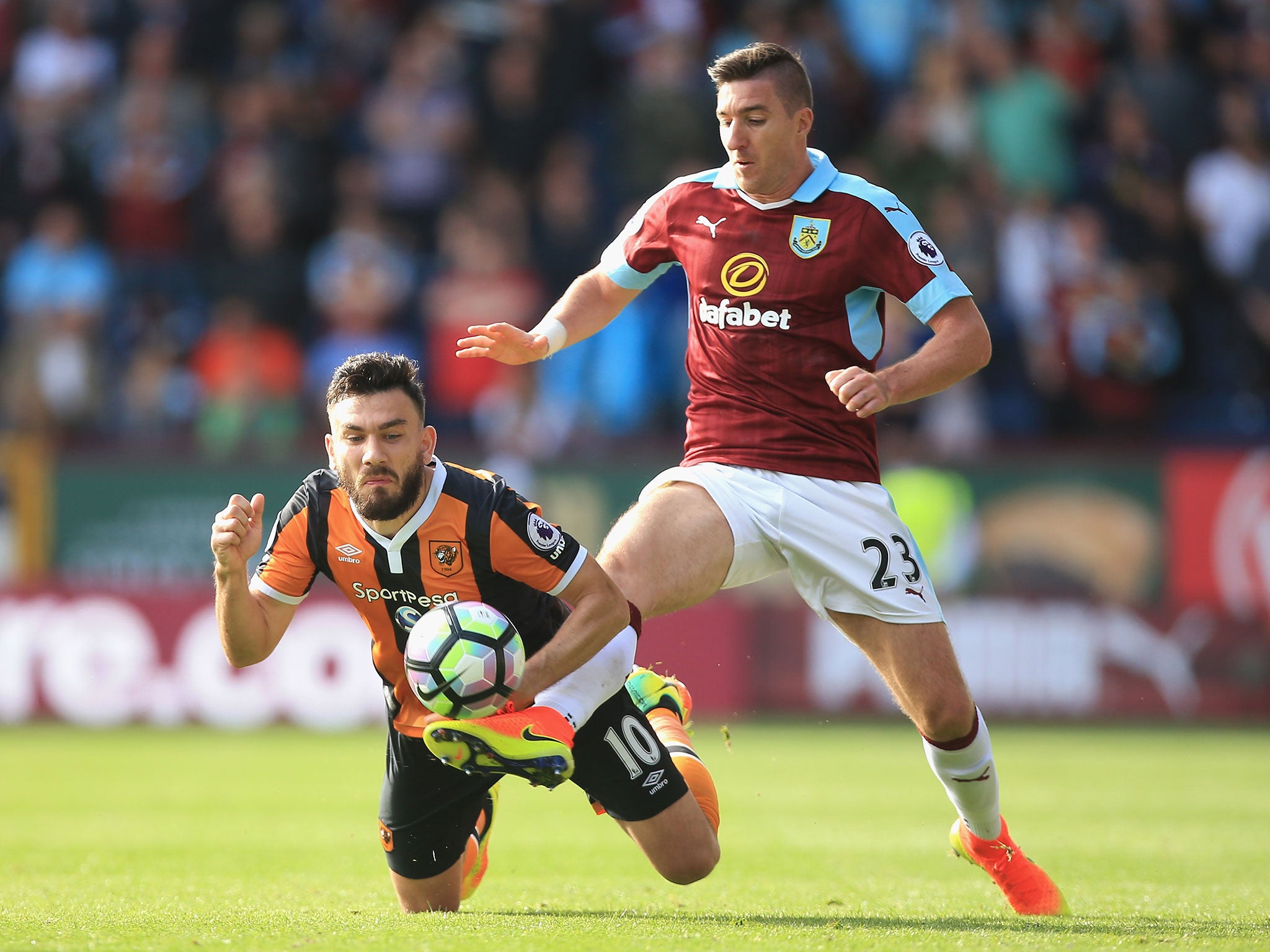 Stephen Ward of Burnley (R) takes the ball past Robert Snodgrass of Hull City (L) during Saturday's 3pm Premier League clash at Turf Moor