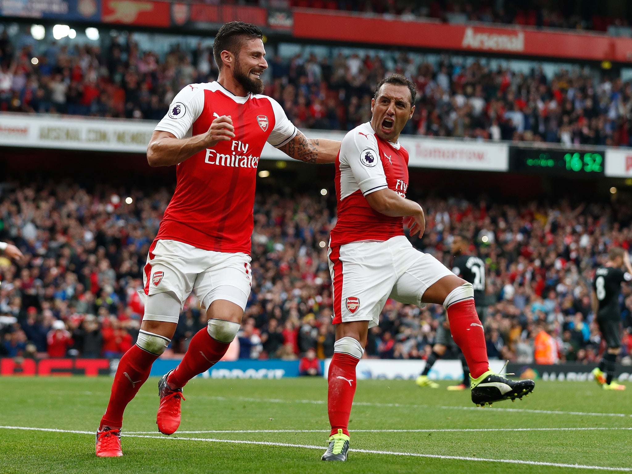 Cazorla celebrates his late winner with team-mate Giroud