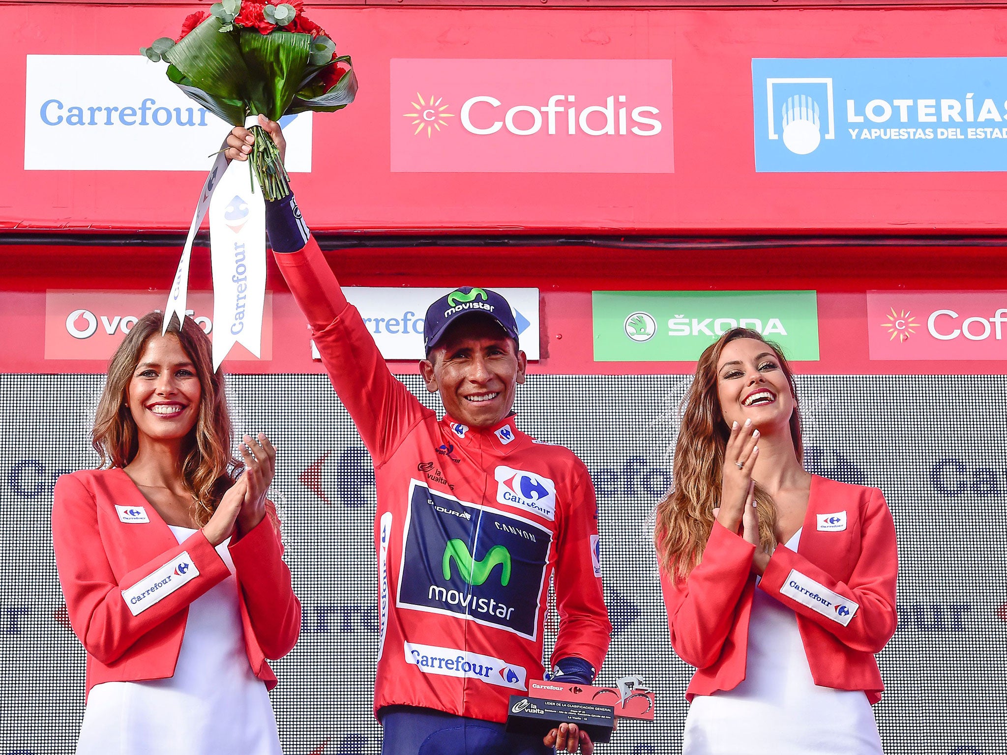 Movistar's Colombian cyclist Nairo Quintana celebrates on the podium retaining the red jersey after 20th stage of the 71st edition of 'La Vuelta' Tour of Spain