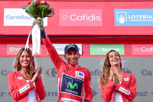 Movistar's Colombian cyclist Nairo Quintana celebrates on the podium retaining the red jersey after 20th stage of the 71st edition of 'La Vuelta' Tour of Spain