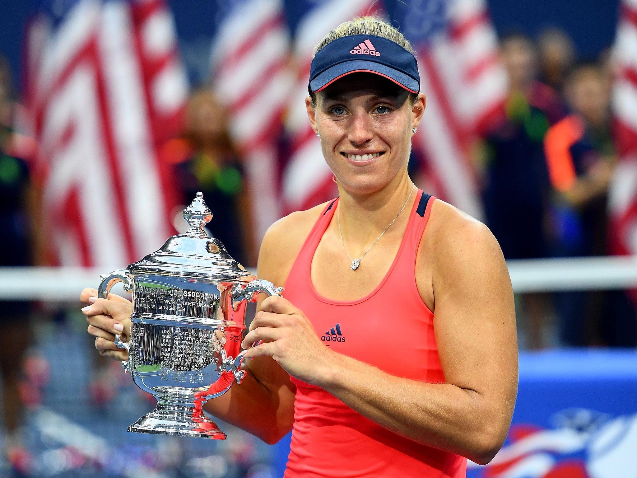 Kerber celebrates with the US Open trophy after her victory over Pliskova