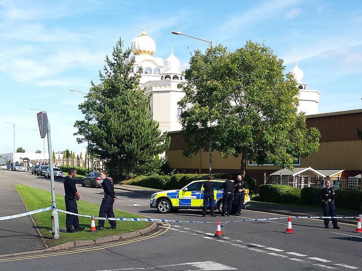 Police outside the Gurdwara Temple in Leamington Spa after it was stormed by a group of men armed with knives