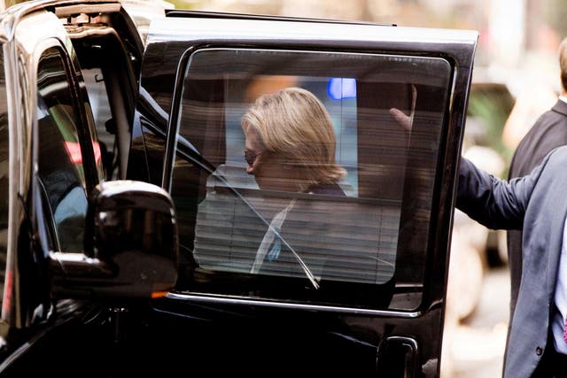 Hillary Clinton gets into a van as she leaves an apartment building in New York hours after she left the 9/11 anniversary memorial early