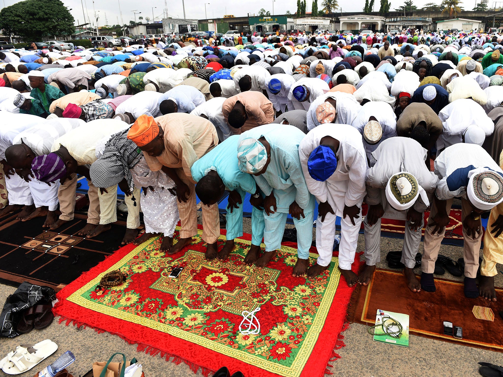 Men pray outdoors in Lagos, Nigeria on 12 September