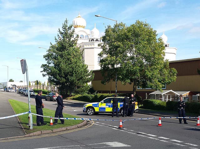 Police outside the Gurdwara Temple in Leamington Spa after it was stormed by a group of men armed with knives