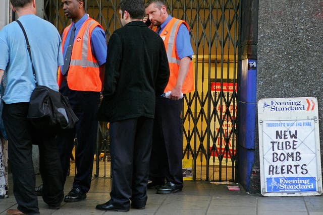 Underground staff at Leicester Square station direct commuters after the attempted bombings of 21 July, 2005