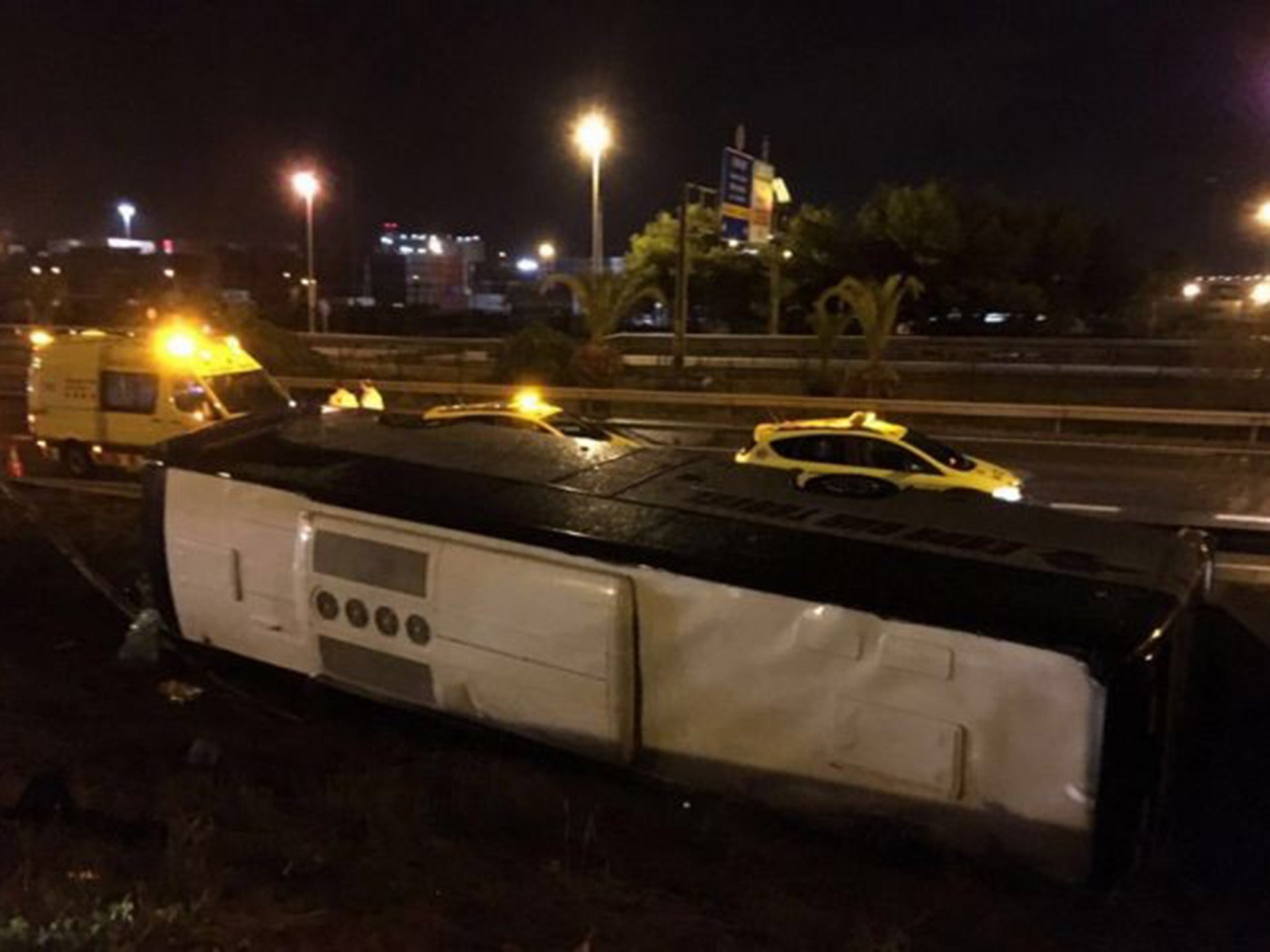 A photo of the overturned bus in Barcelona where 24 people were injured