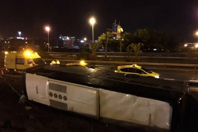 A photo of the overturned bus in Barcelona where 24 people were injured
