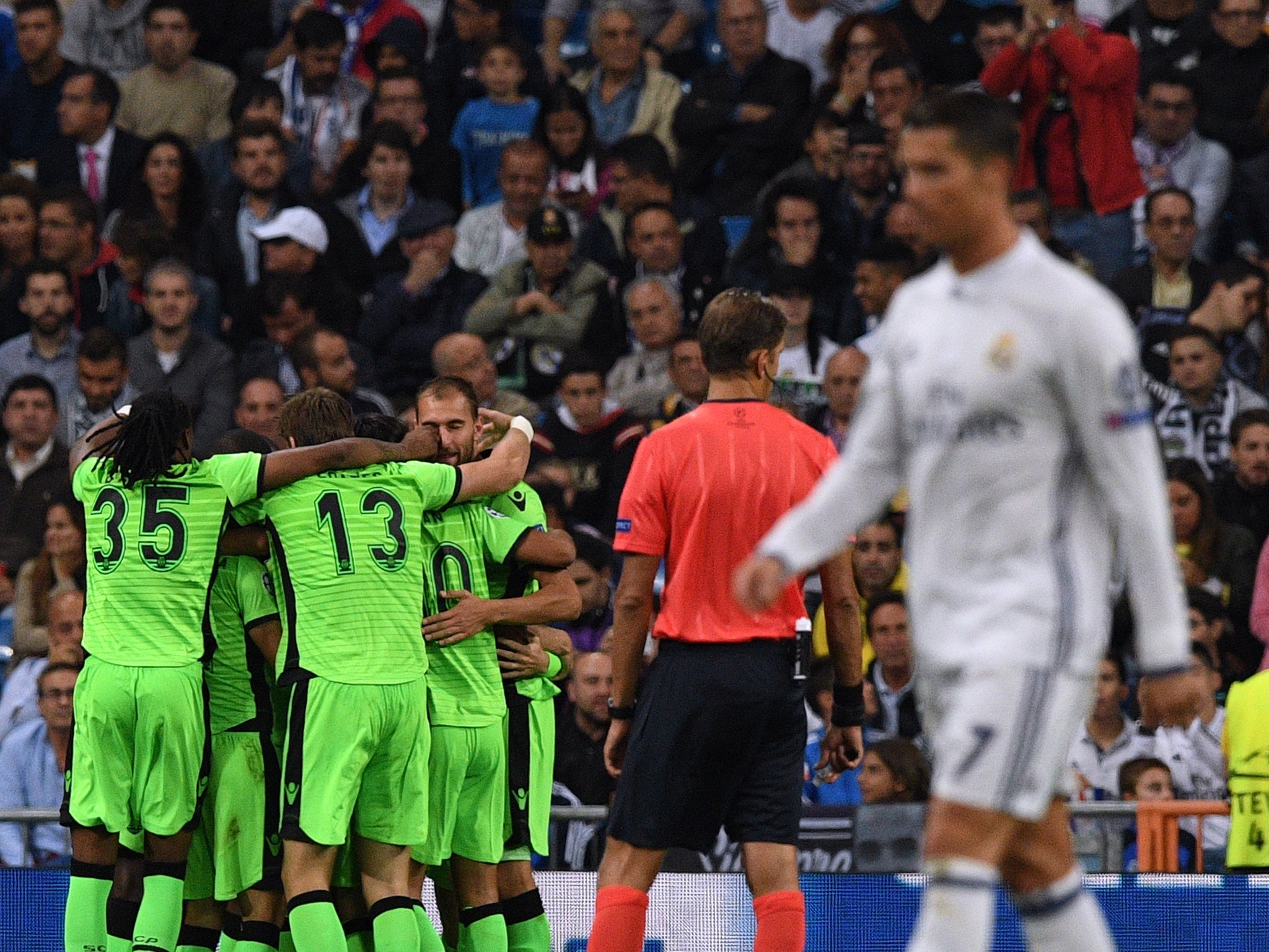 Sporting celebrate as Ronaldo walks back to the halfway line