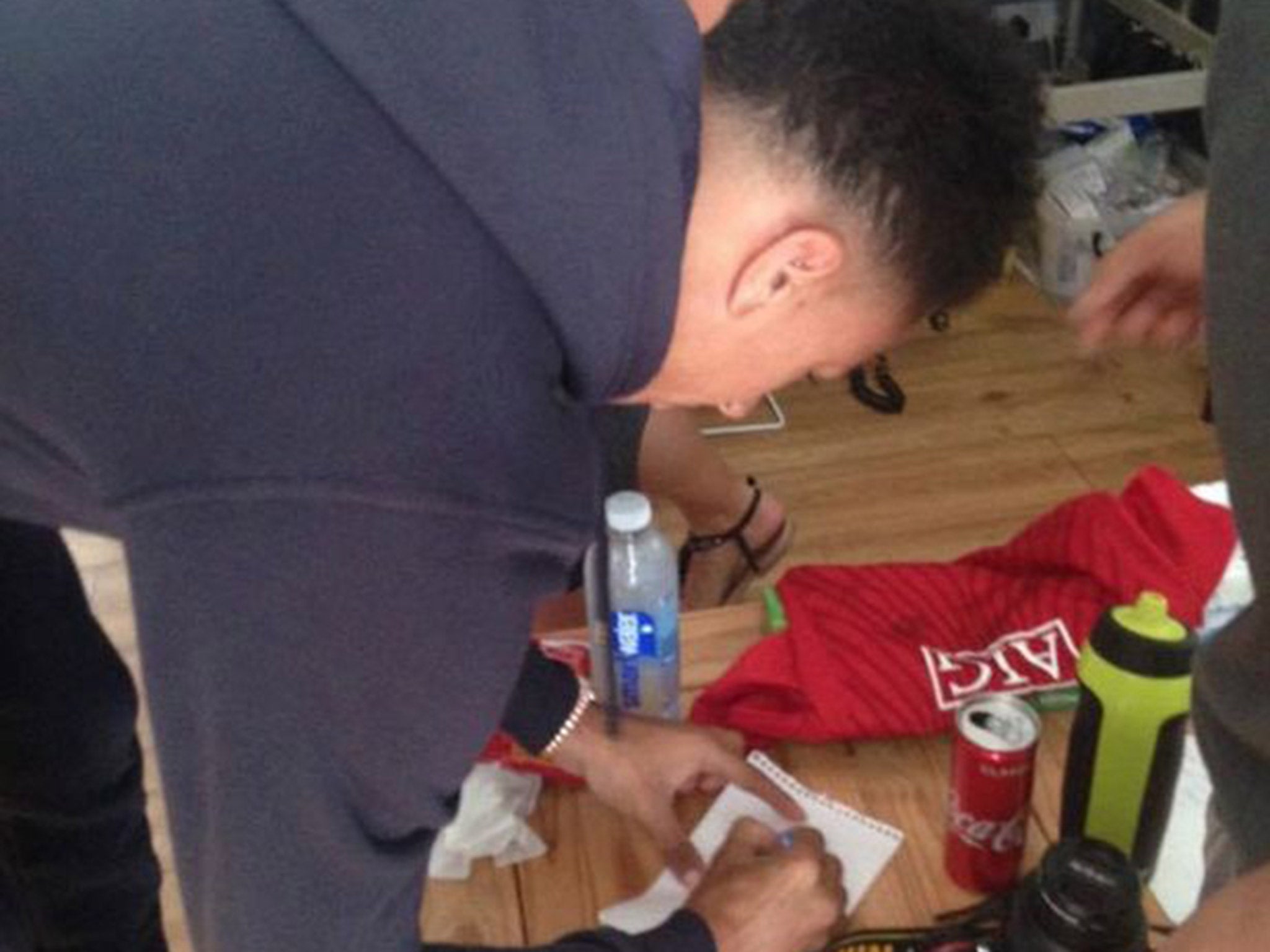 Jesse Lingard took the time to sign United memorabilia for Mr Lawler's family