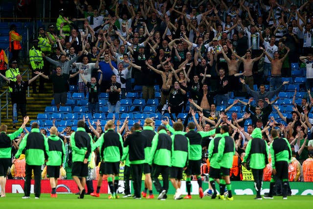 Borussia Monchengladbach players applaud their fans after the game was postponed