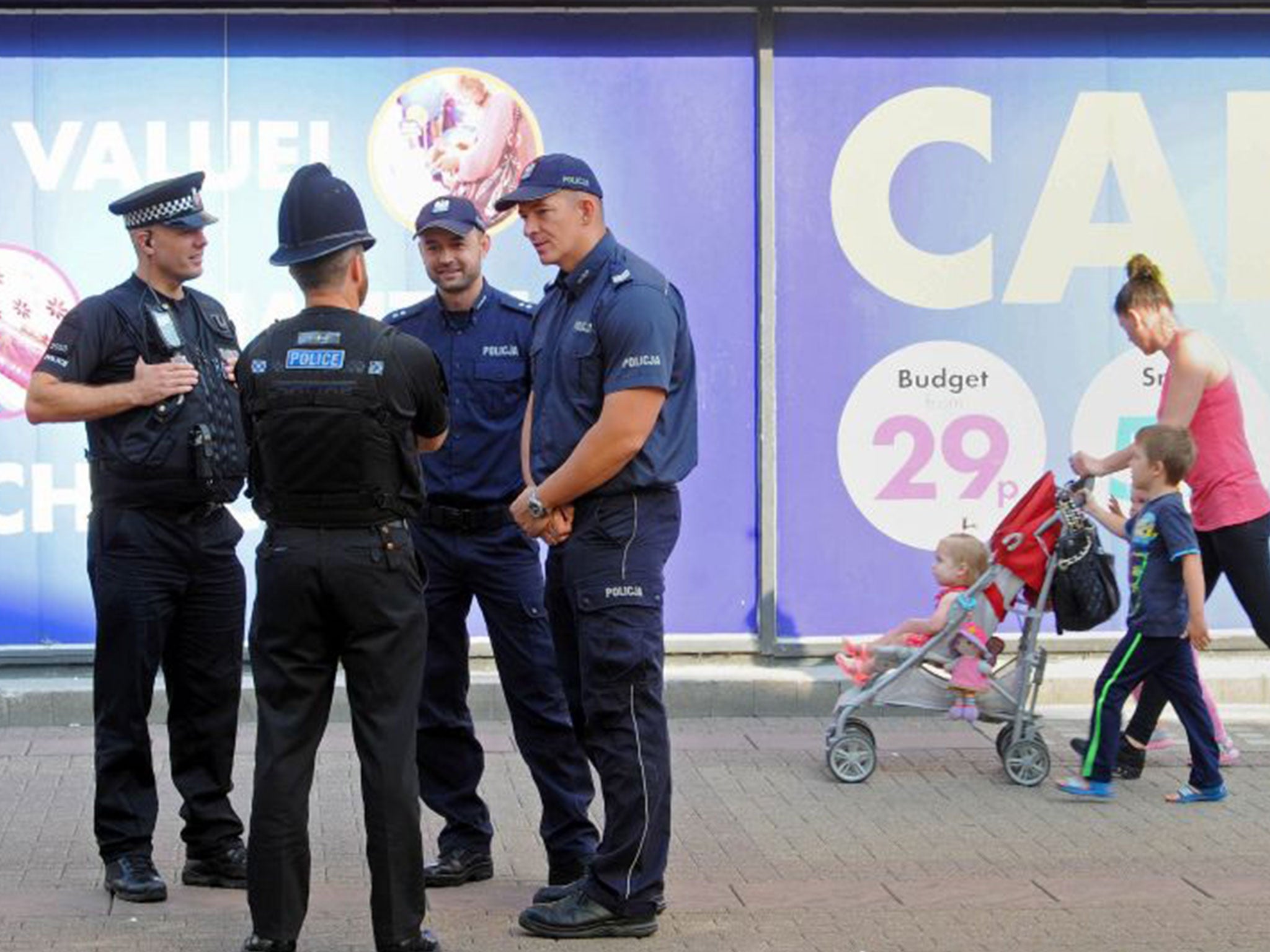 Chief Sergeant Dariusz Tybura (right) and Second Lieutenant Bartosz Czernicki (second from right), with Essex Police officers on patrol in Harlow