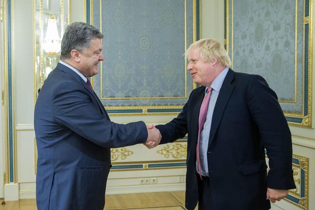 Ukrainian President Petro Poroshenko (left) greets Boris Johnson during their meeting in Kiev