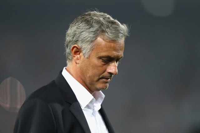 Jose Mourinho appears dejected during the defeat by Feyenoord last week