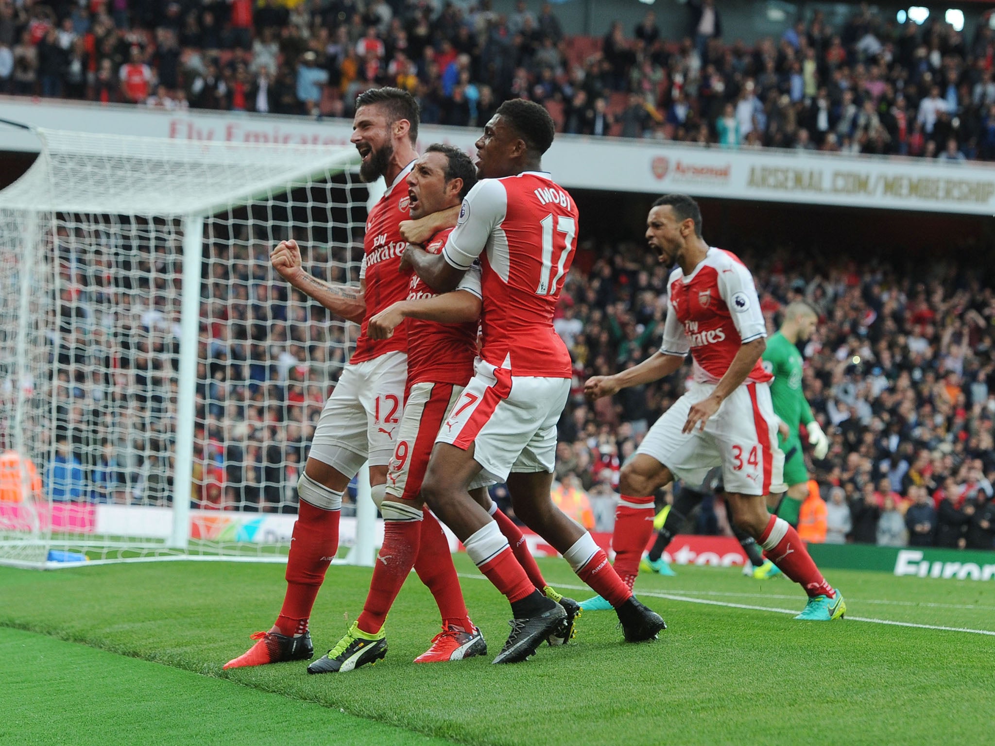 Arsenal celebrate Santi Cazorla's late winner against Southampton