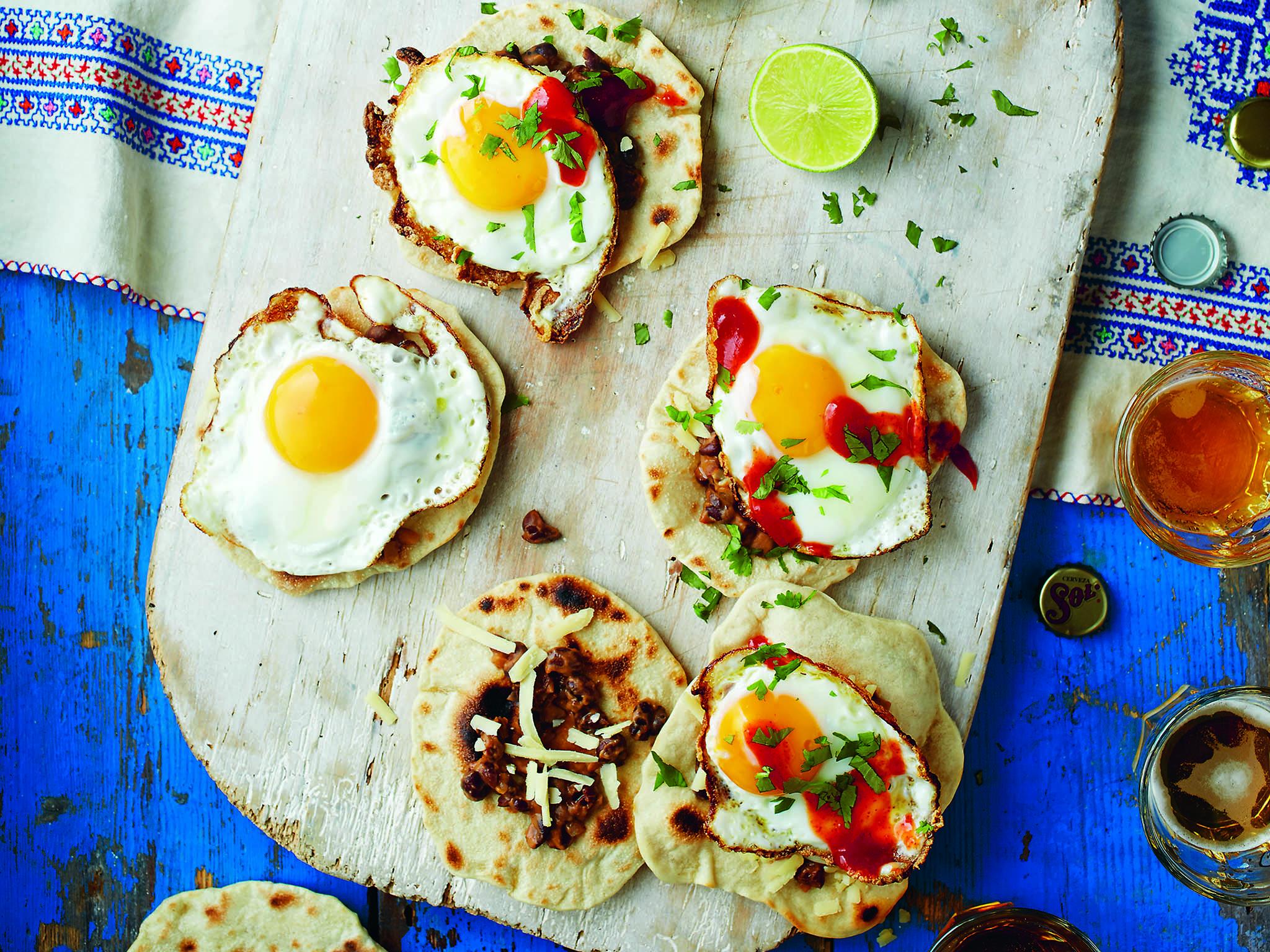 Refried beans with chilli tacos topped with fried egg is a great brunch for Mexican lovers