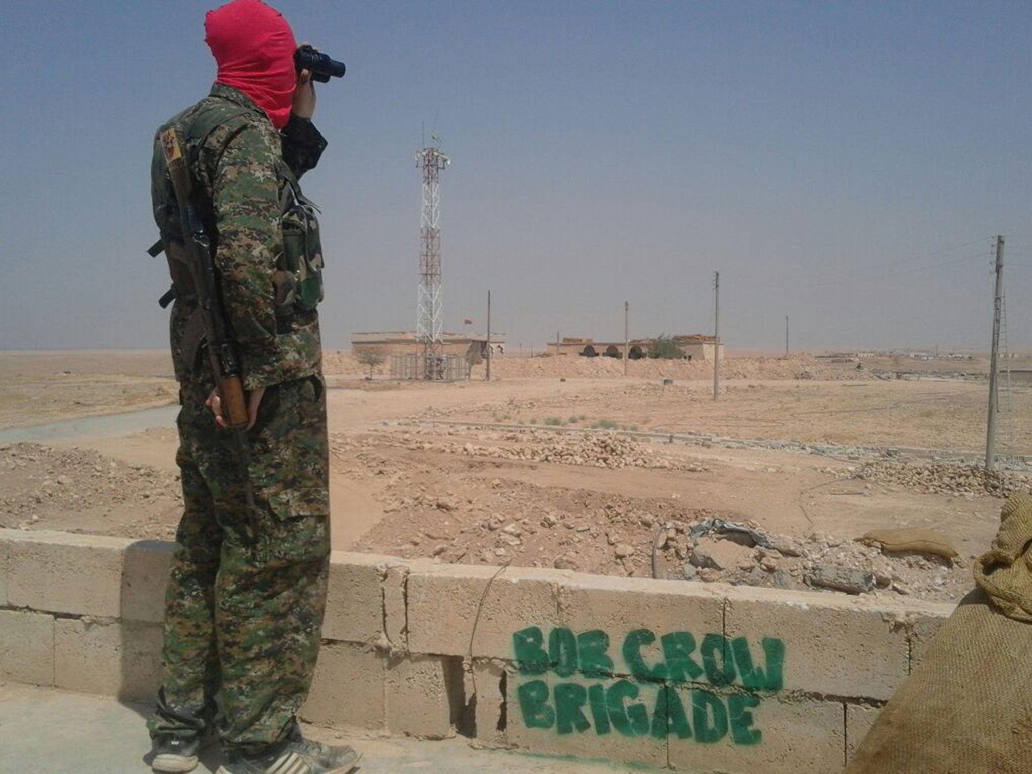 A member of the Bob Crow Brigade keeping watch in northern Syria