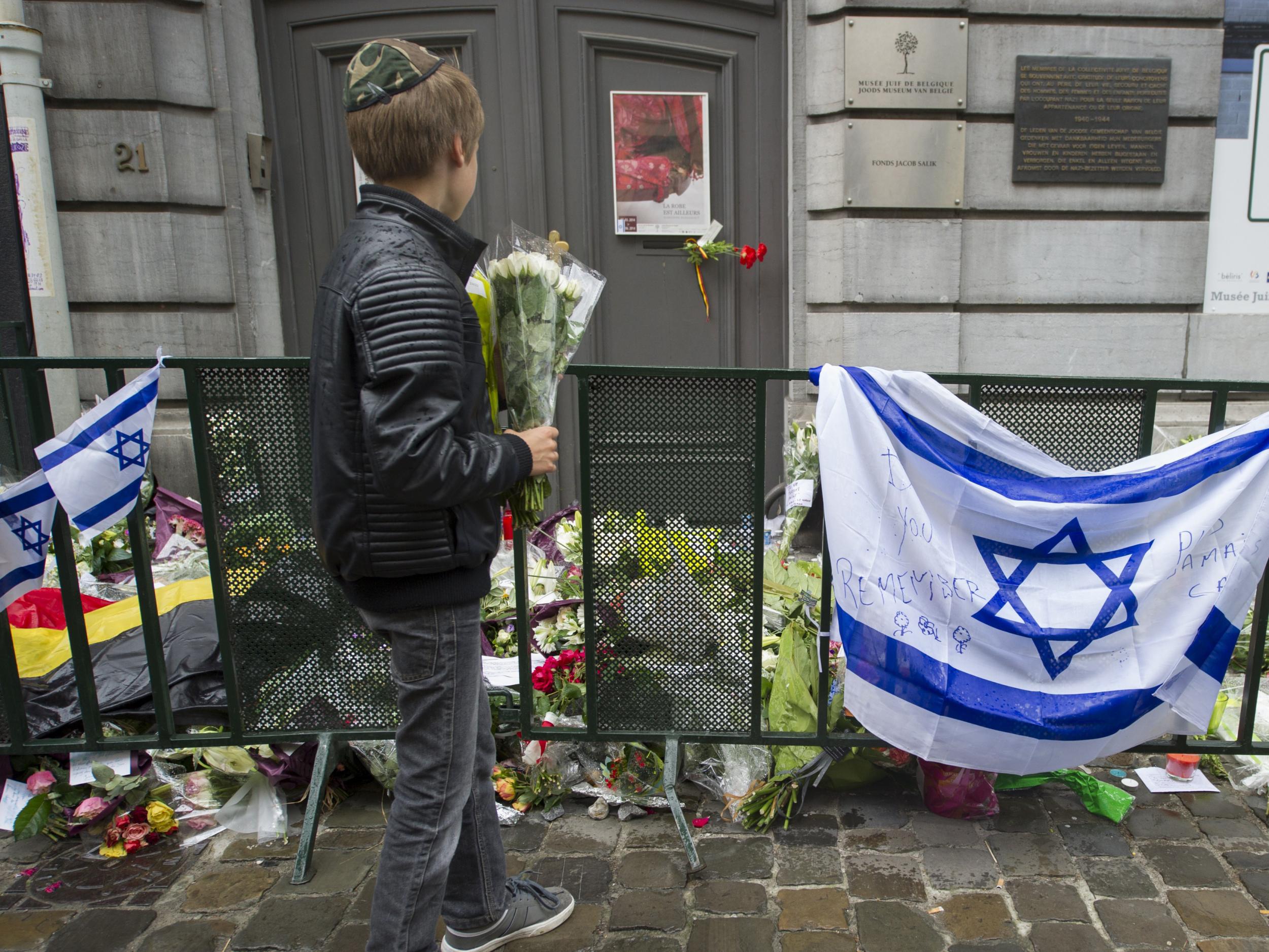 Flowers are laid outside Brussels' Jewish Museum after a terrorist attack left four dead in 2014