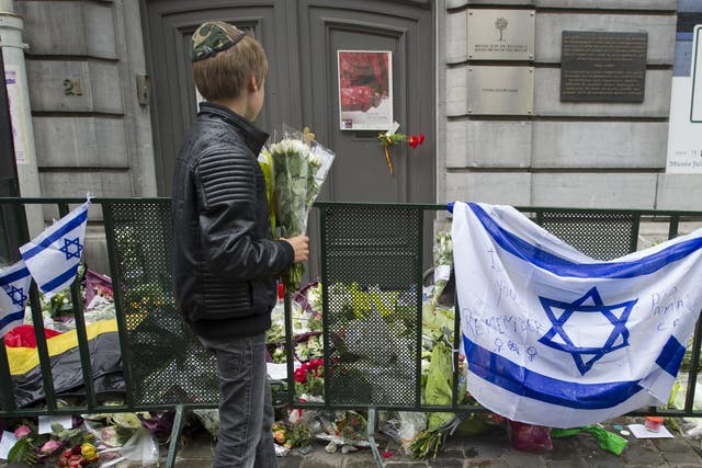 Flowers are laid outside Brussels' Jewish Museum after a terrorist attack left four dead in 2014