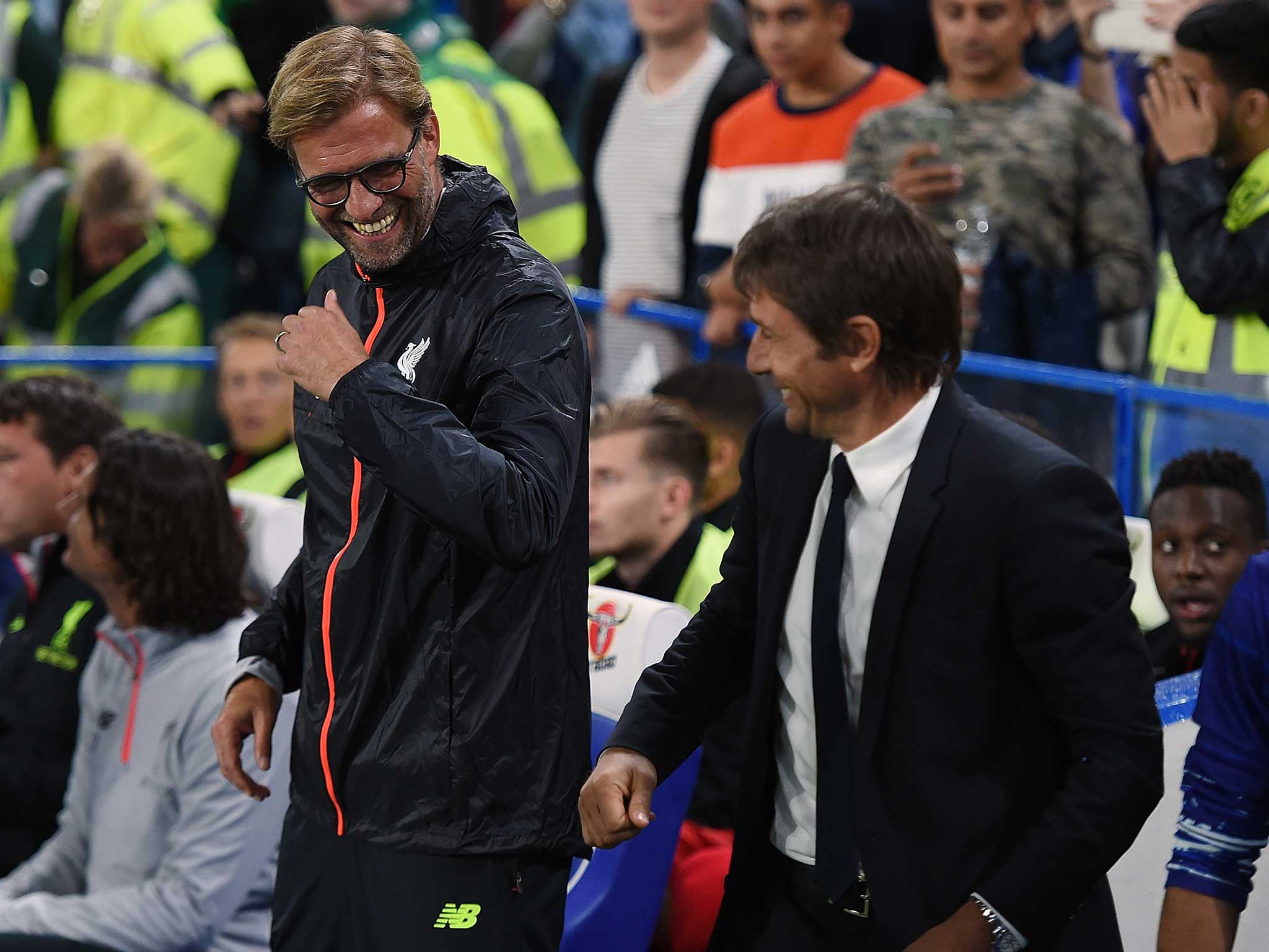 Jurgen Klopp and Antonio Conte share a joke on the side-lines