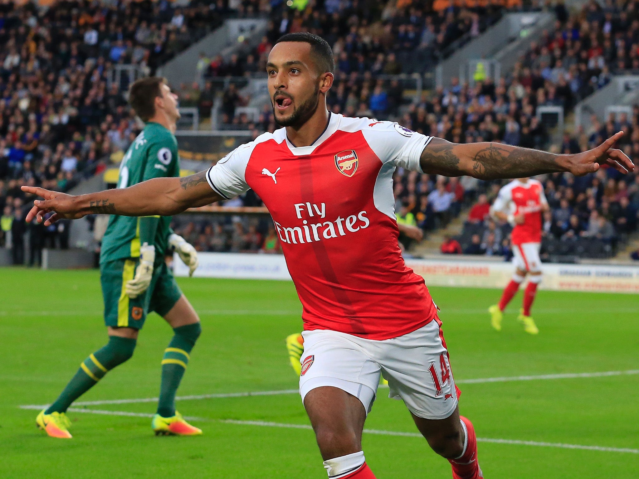 Theo Walcott doubled Arsenal's lead with a neat chip