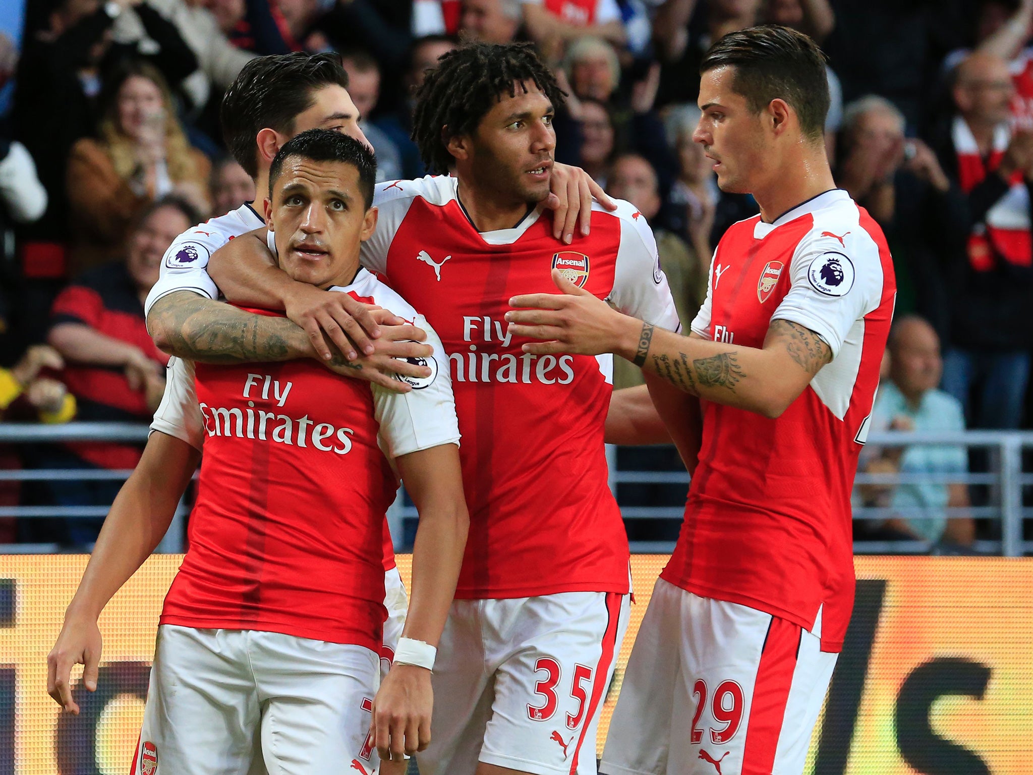 Sanchez celebrates his second goal with his Arsenal teammates