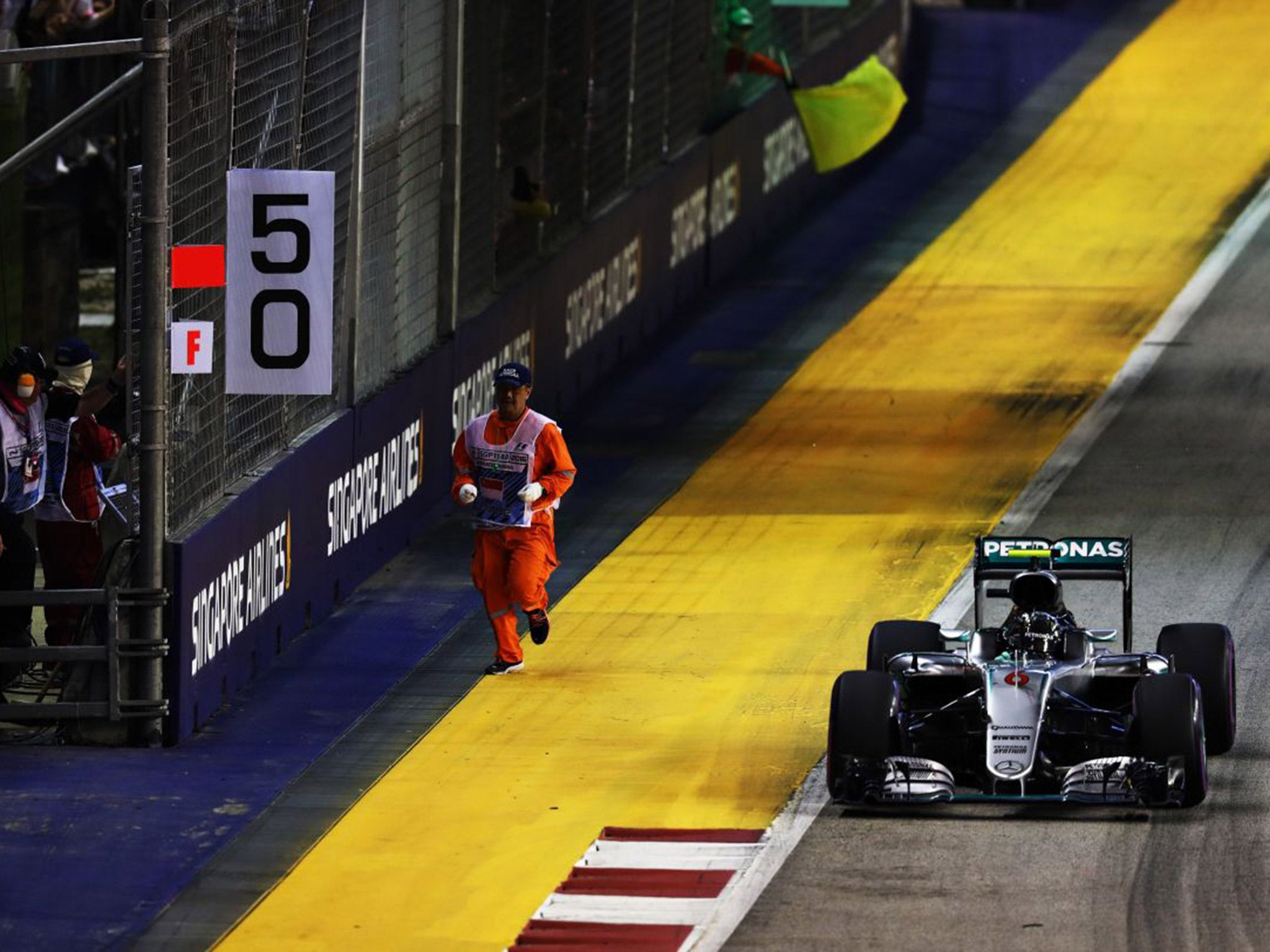 Nico Rosberg narrowly avoids hitting a marshal during the Singapore Grand Prix