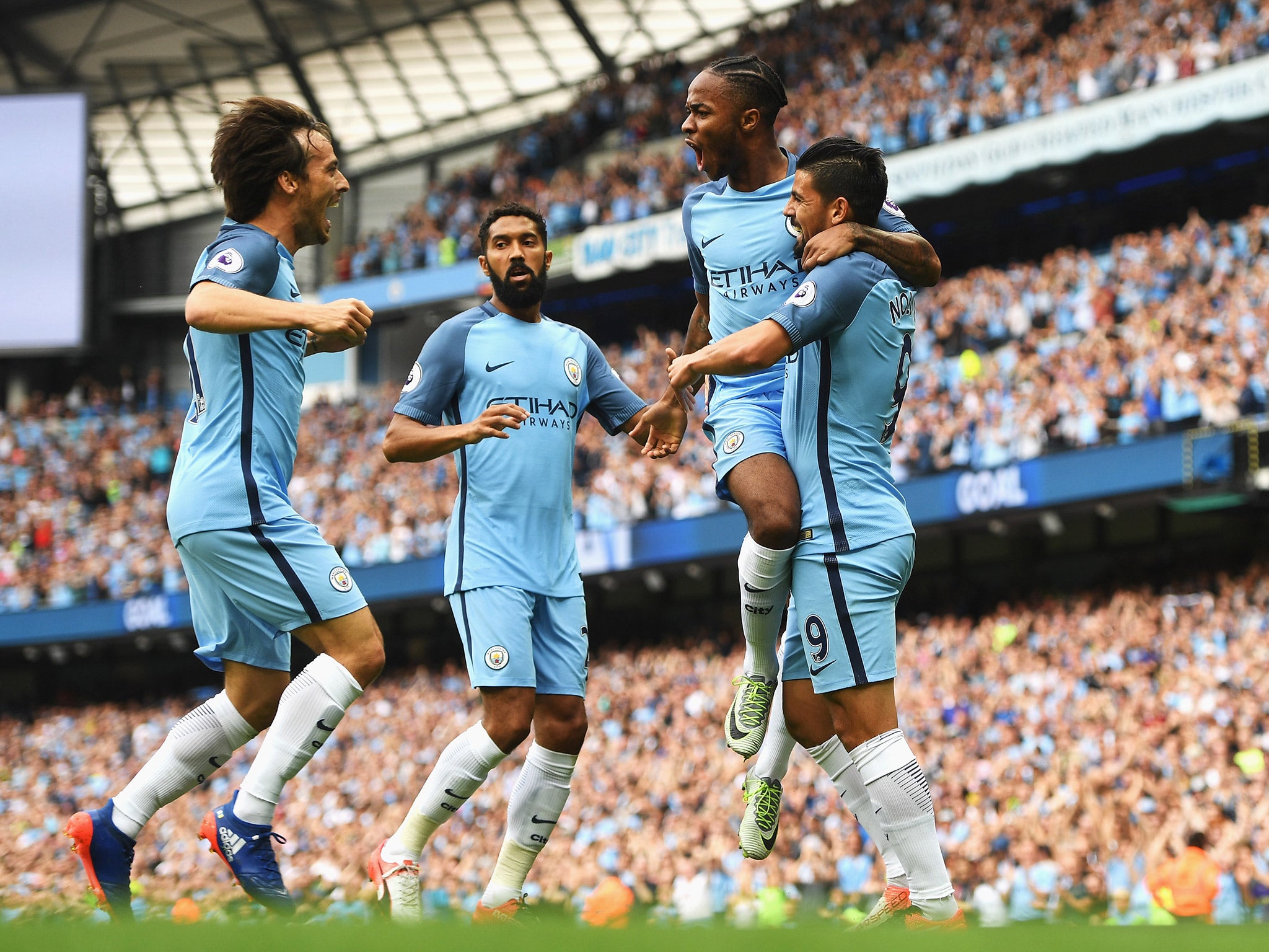 Gael Clichy (second left) celebrates with his Manchester City teammates