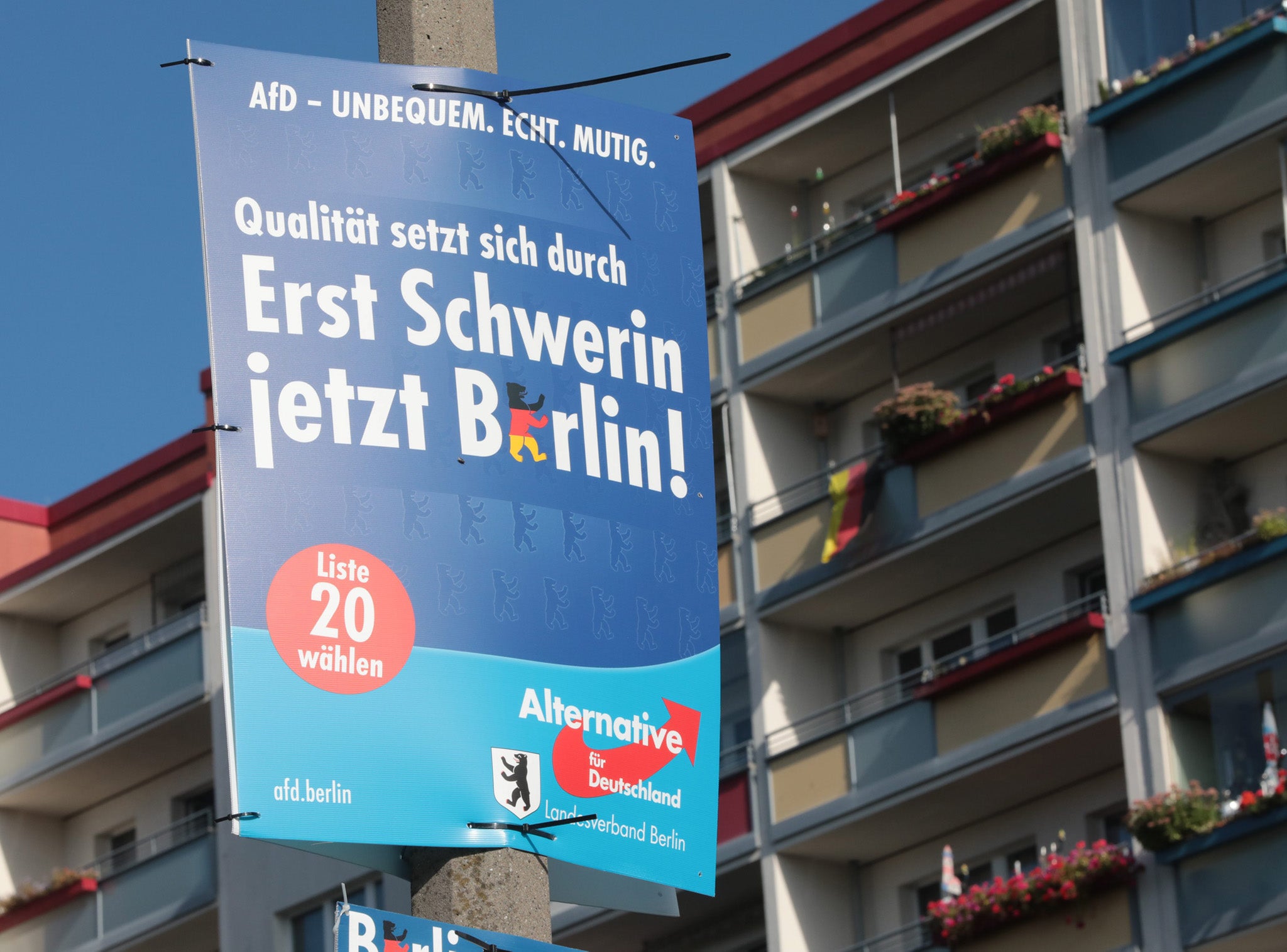 An election poster of Alternative for Germany (AfD) party hangs from a lamppost in the Marzahn-Hellersdorf area of Berlin, Germany