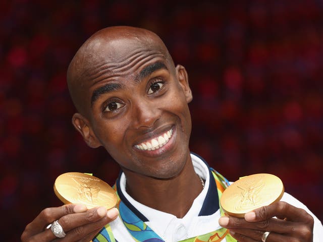 Farah poses with his two Rio Olympic gold medals