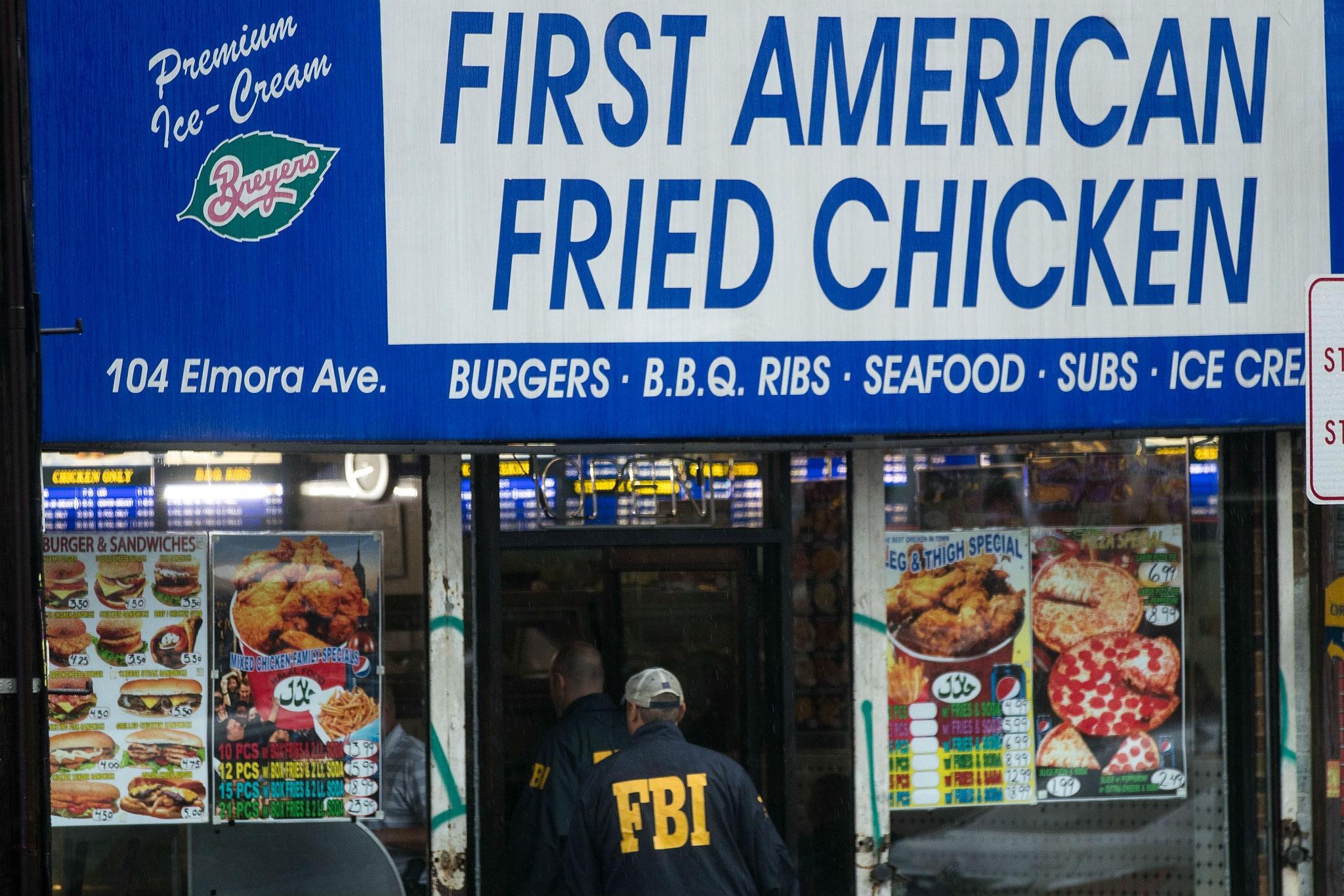 FBI investigators at the Rahami family's fried chicken restaurant in Elizabeth, New Jersey on Monday