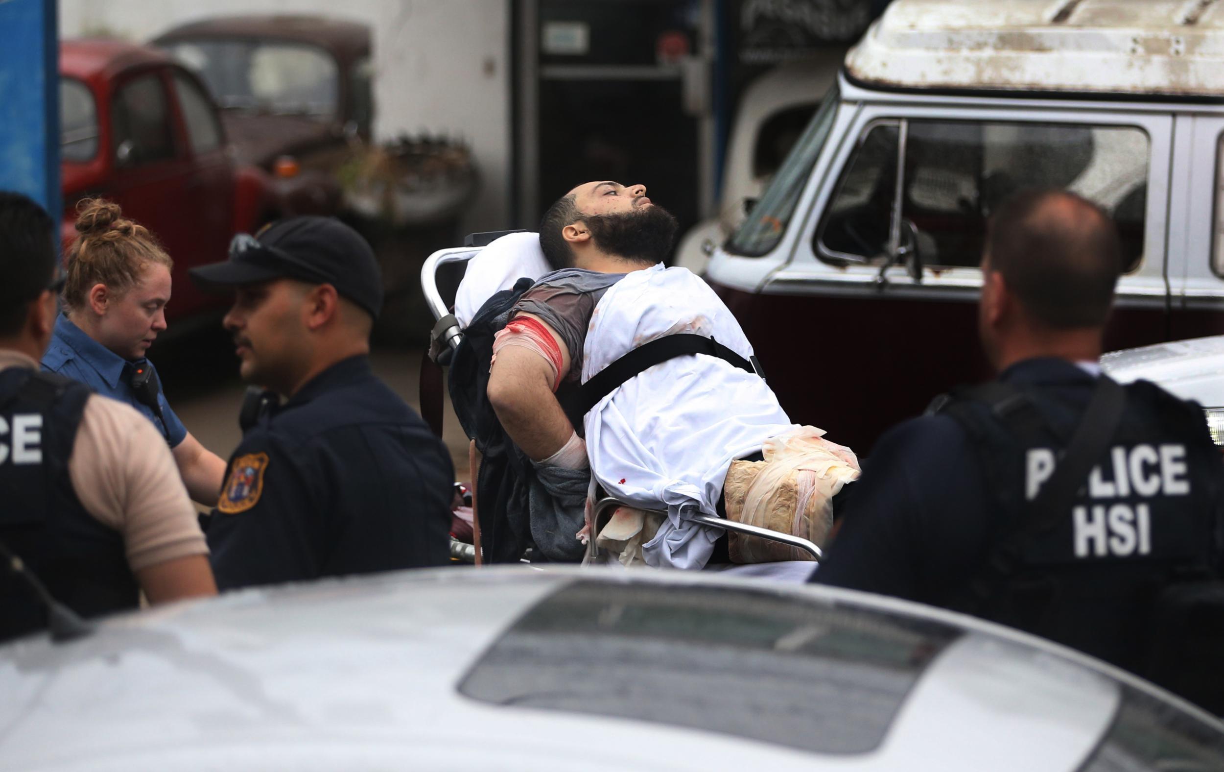 Ahmad Khan Rahami is taken into custody after a shootout with police Monday, Sept. 19, 2016, in Linden, New Jersey. Rahami was wanted for questioning in the bombings that rocked the Chelsea neighborhood of New York and the New Jersey shore town of Seaside Park.