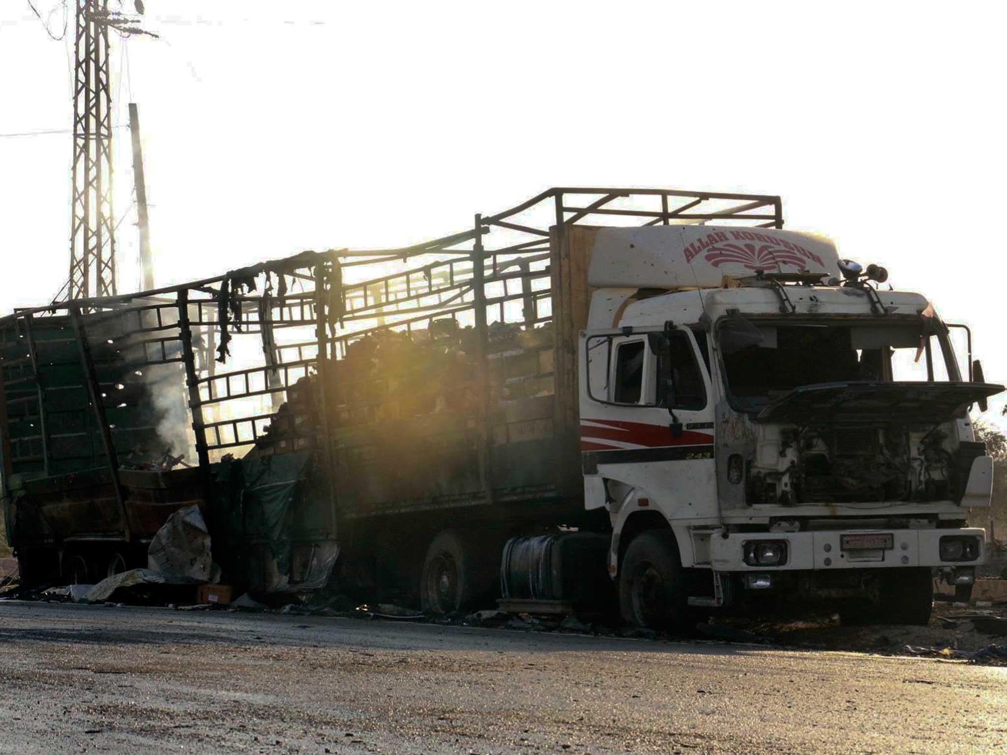 A burnt out vehicle is abandoned in the road after the fire