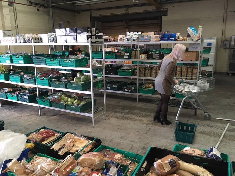 A shopper browses the shelves in the UK’s first food waste supermarket