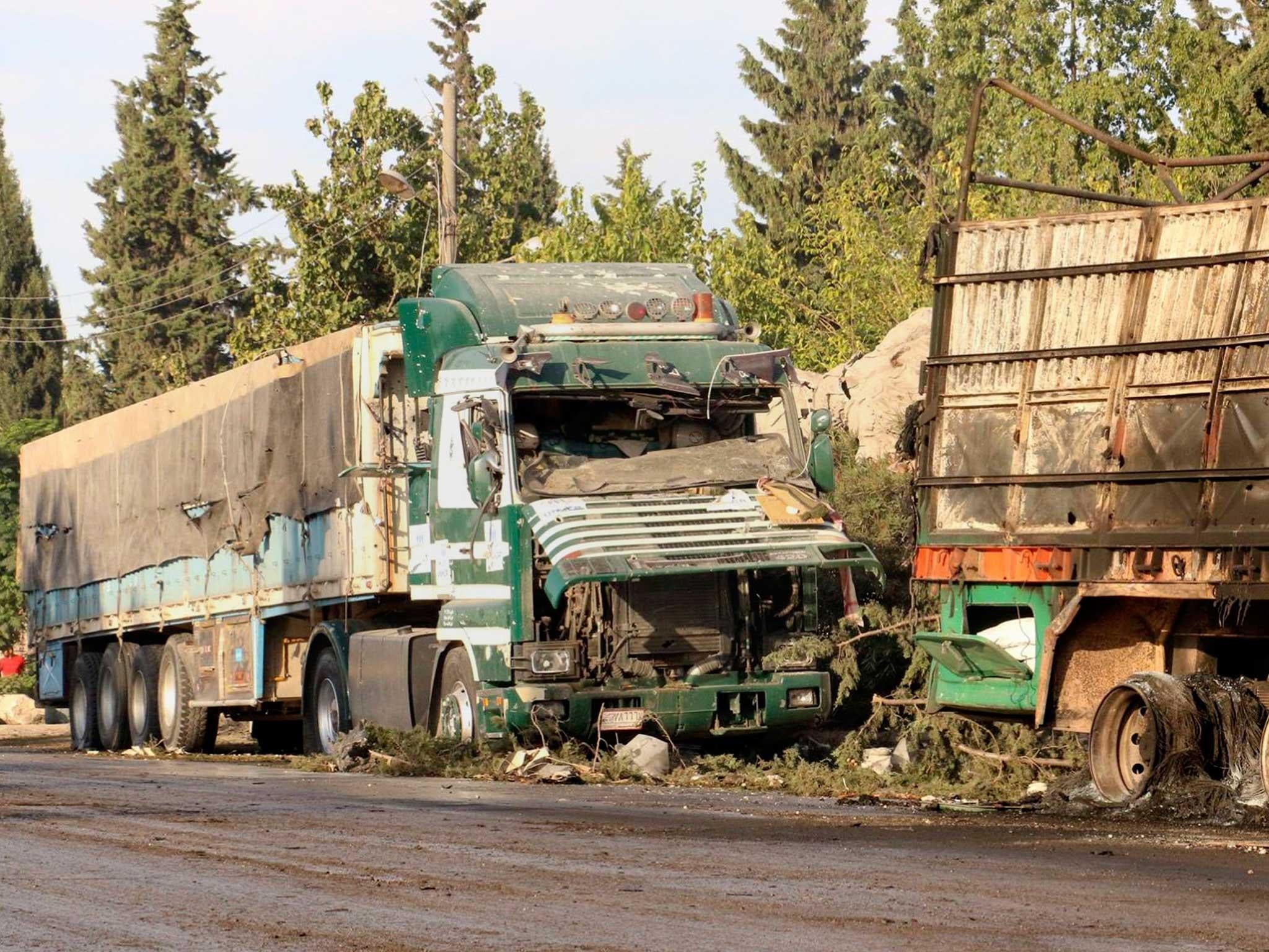 Damaged trucks carrying aid, in Aleppo