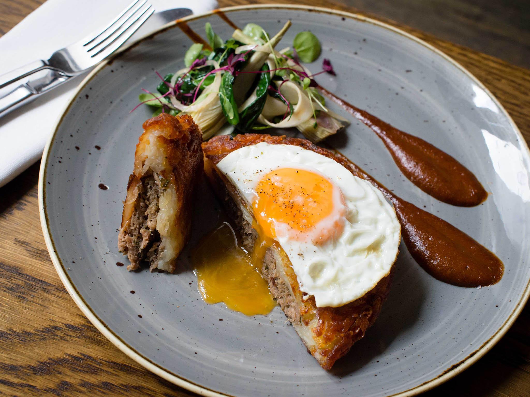 The confit duck hash brown, served with a duck egg on top, £9