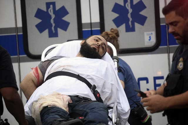 Ahmad Khan Rahami is taken into custody after a shootout with police on Monday