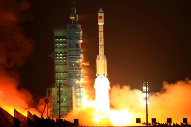 China's Long March 2F rocket carrying the Tiangong-1 module, or "Heavenly Palace", blasts off on September 29, 2011